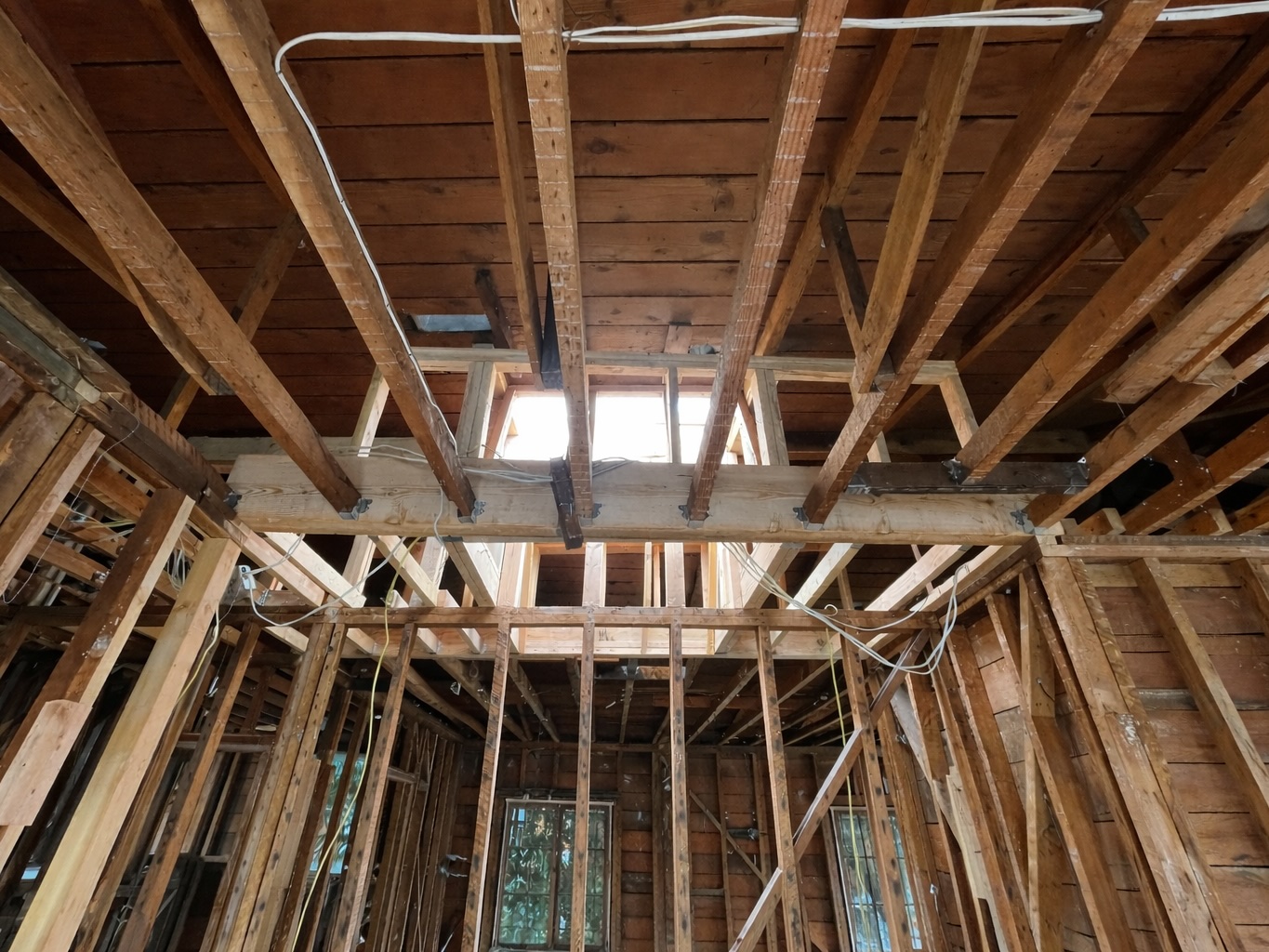 Framing and structural beam installation during home addition
